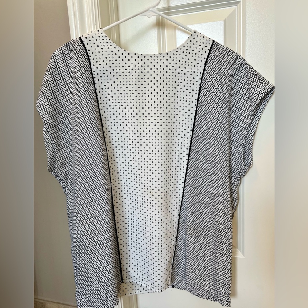 Express size S, white and black top with black piping running along front.